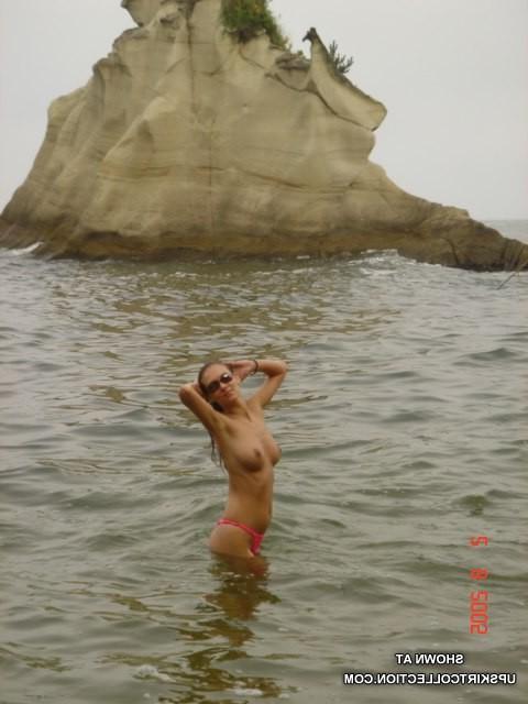 15P Beautiful girls without bras pose in wet bikinis