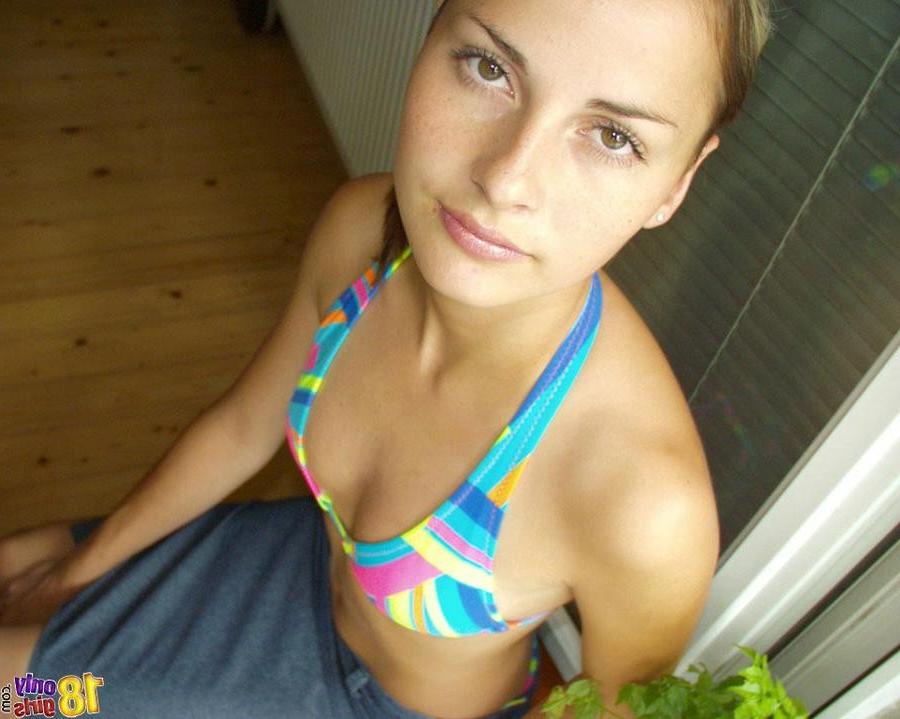 15P Tiny teen takes off her little bikini top and oils herself