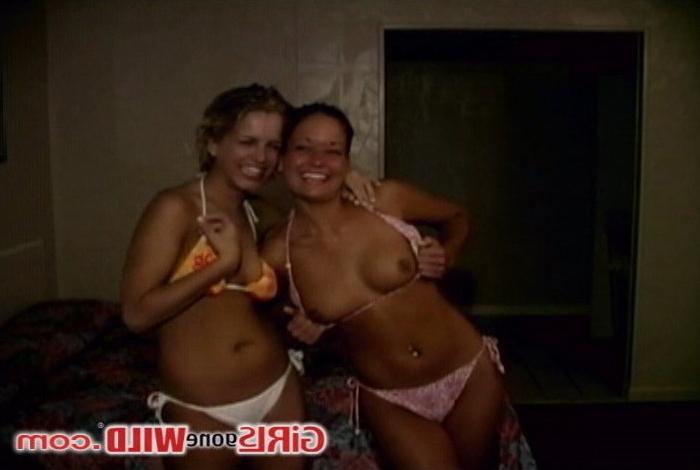 10P Two tan bikini babes flashing their perky young tits
