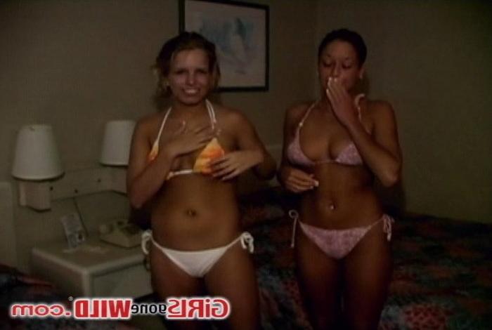 10P Two tan bikini babes flashing their perky young tits