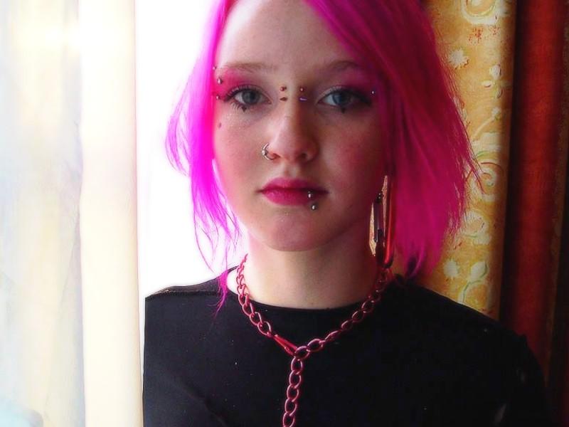 16P Pink haired goth babe Masscha shows her large pierced nipples