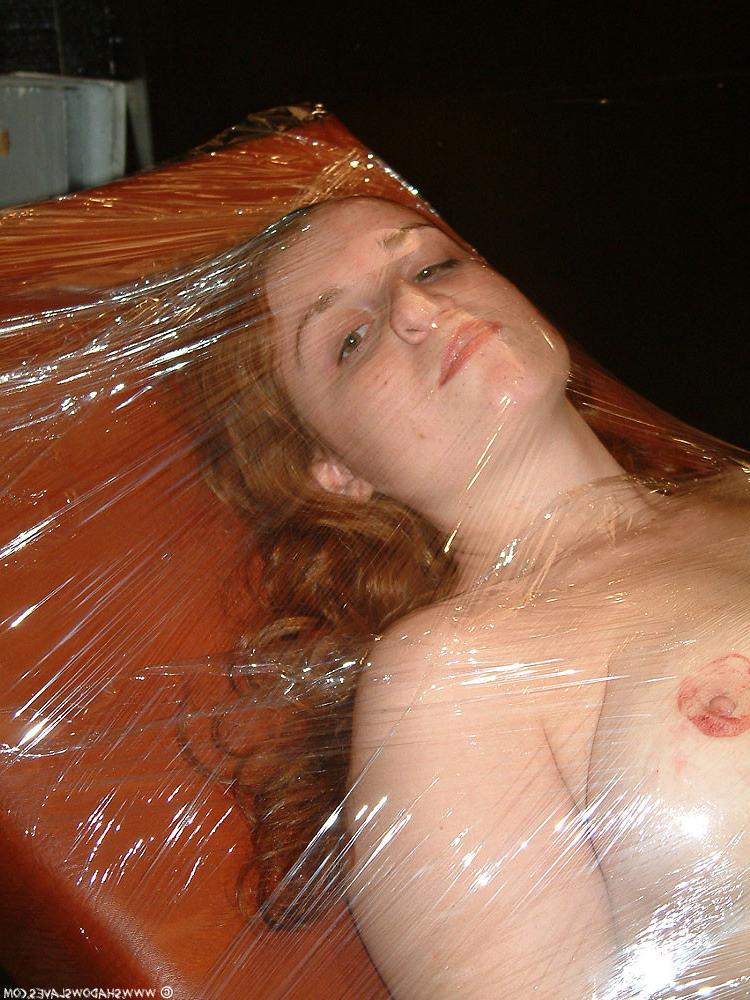 15P Saran wrapped red haired slavegirl