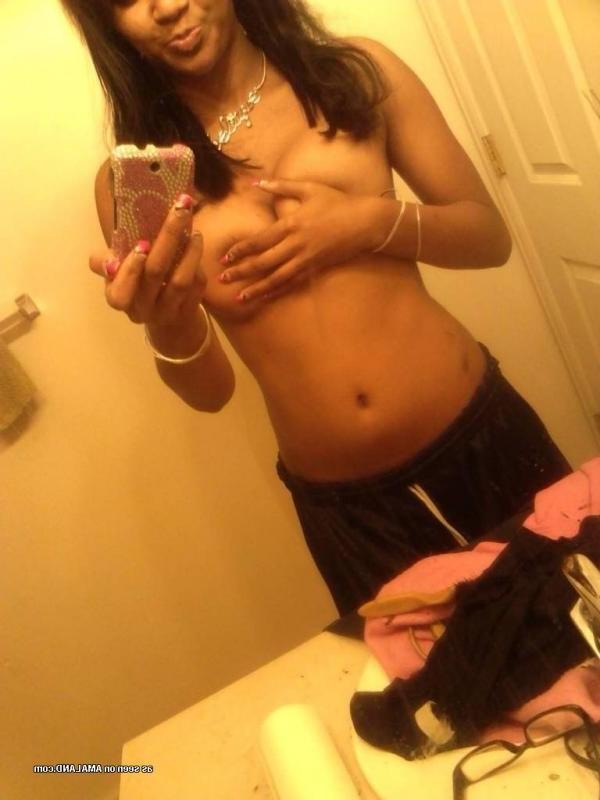 14P Pretty black GF showing her tits in hot mirror shots