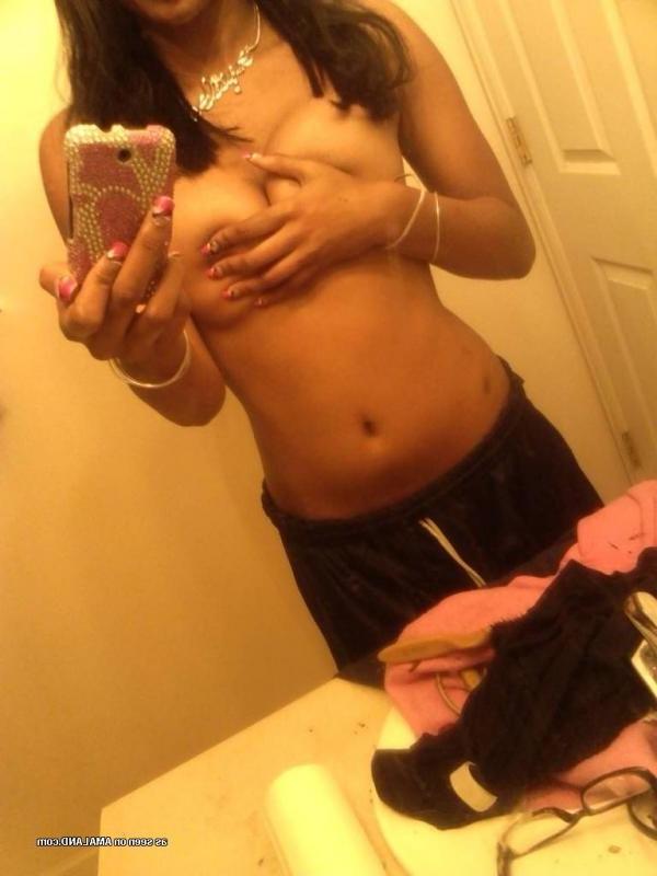 14P Pretty black GF showing her tits in hot mirror shots