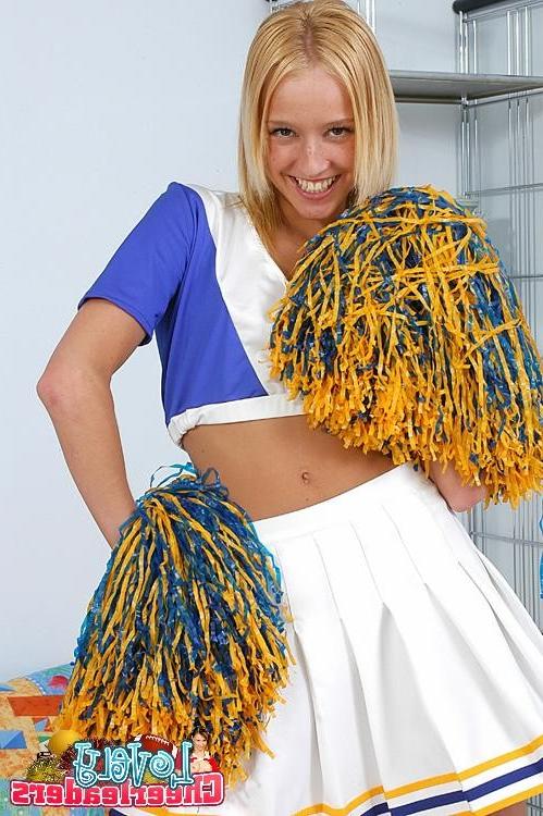 15P Comely blonde cheerleader stripping and spreading her pink cunt wide open