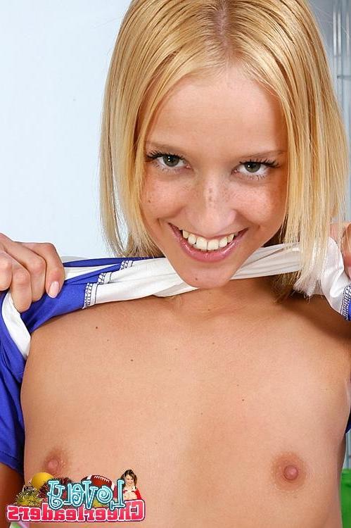 15P Comely blonde cheerleader stripping and spreading her pink cunt wide open