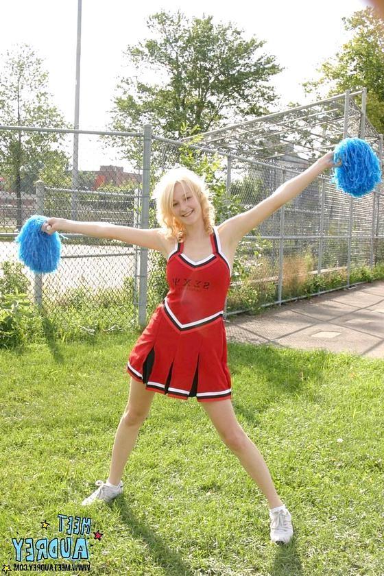 16P Sweet blonde cheerleader showing her nice natural tits outdoors
