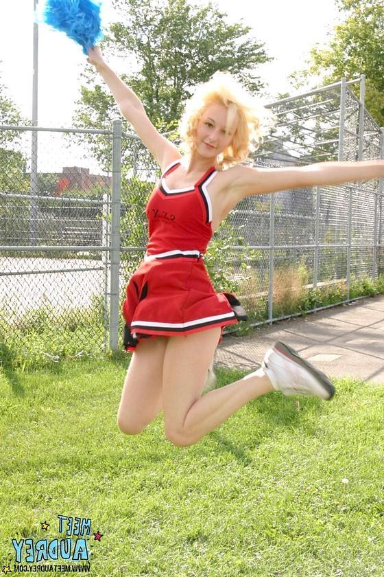 16P Sweet blonde cheerleader showing her nice natural tits outdoors