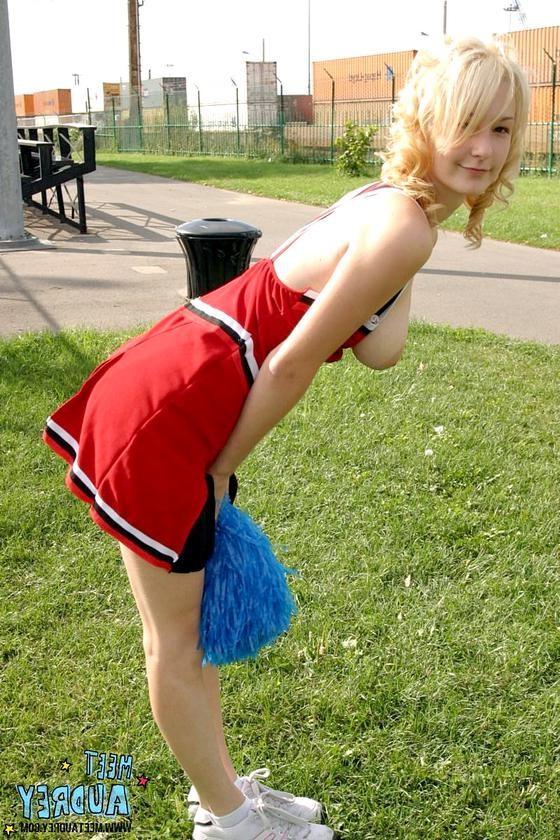16P Sweet blonde cheerleader showing her nice natural tits outdoors