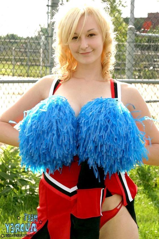 16P Sweet blonde cheerleader showing her nice natural tits outdoors