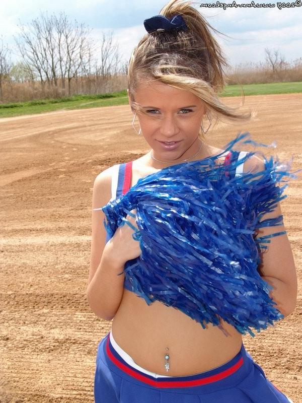15P Busty Blonde Anna posing in a cheerleader outfit