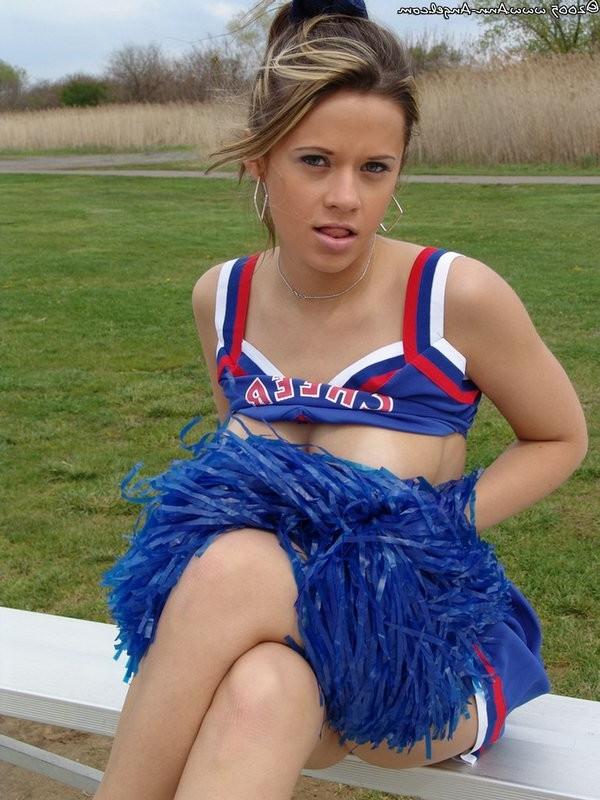 15P Busty Blonde Anna posing in a cheerleader outfit