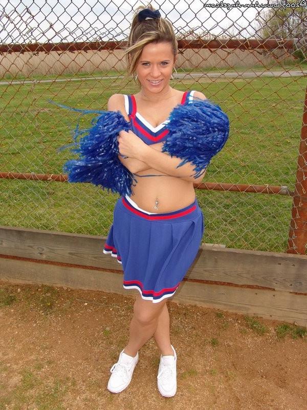 15P Busty Blonde Anna posing in a cheerleader outfit