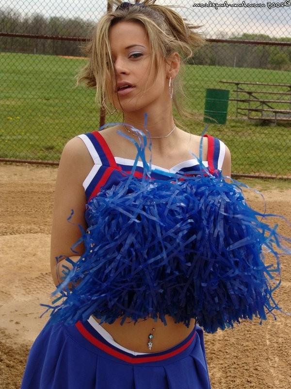 15P Busty Blonde Anna posing in a cheerleader outfit