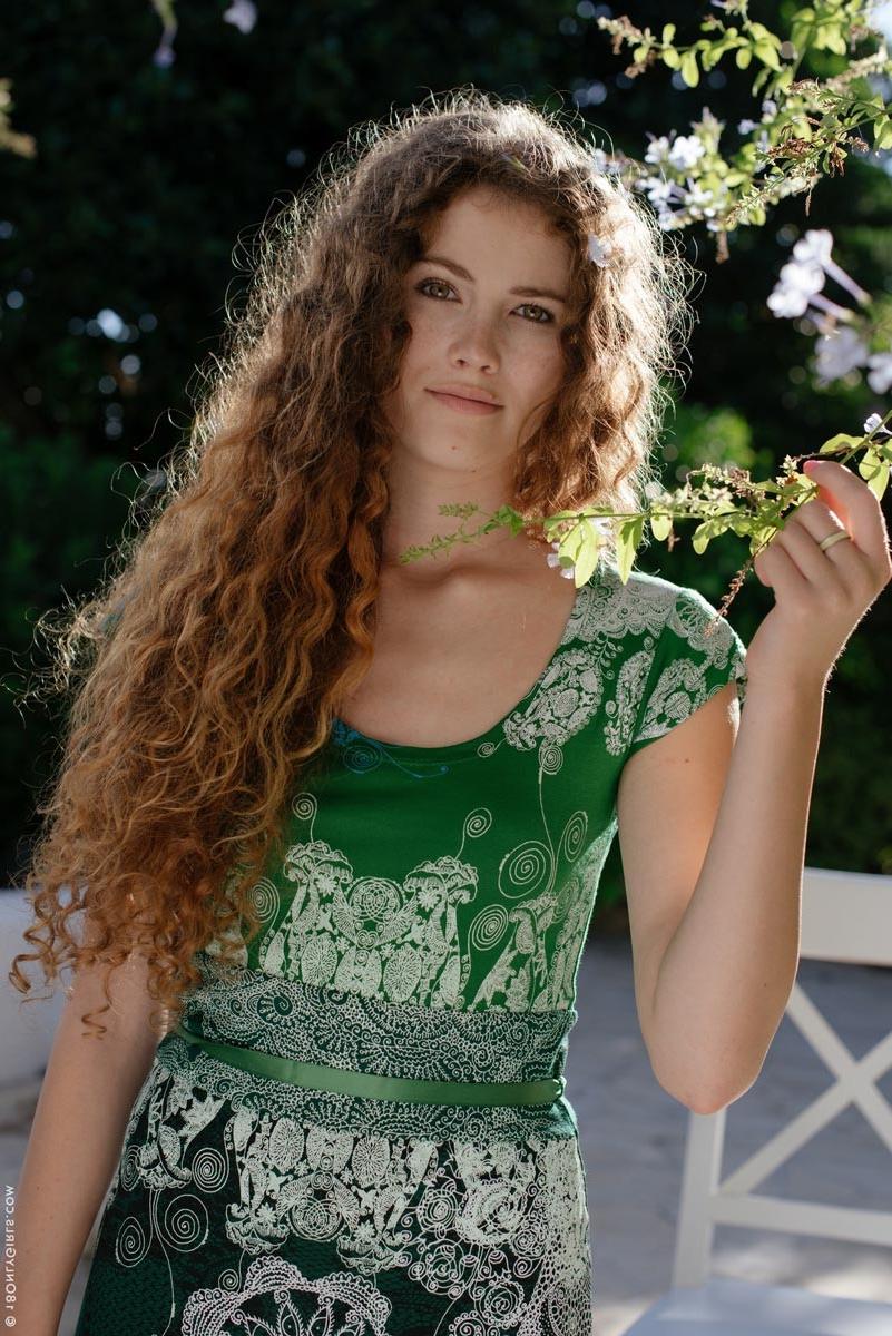15P Beautiful chick with curly hair strips in the sun