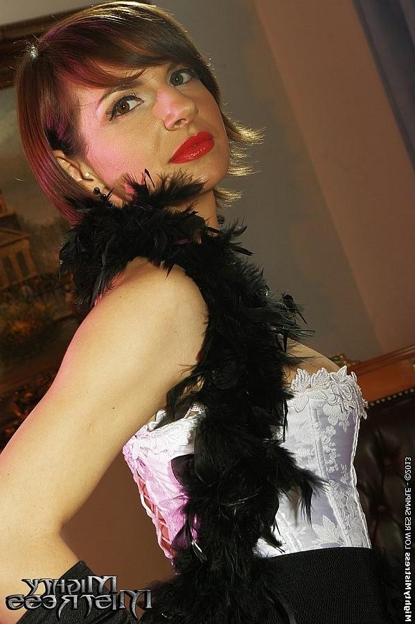 16P Nina Young in stockings and feathers obeying her mistress