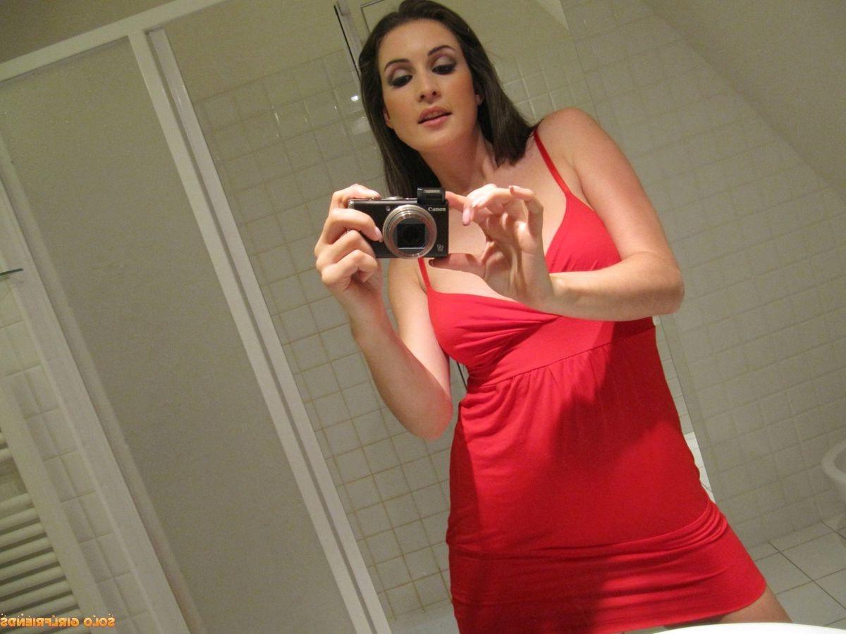 15P Angela Diablo takes photos of herself in mirror