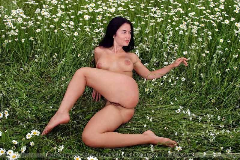 16P Raven haired beauty in field of flowers