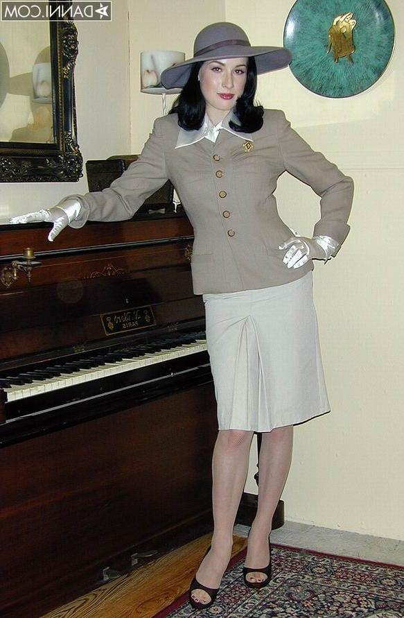 16P Glamour Dita Von Teese in tan stockings undressing