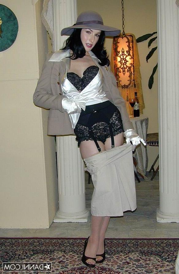 16P Glamour Dita Von Teese in tan stockings undressing