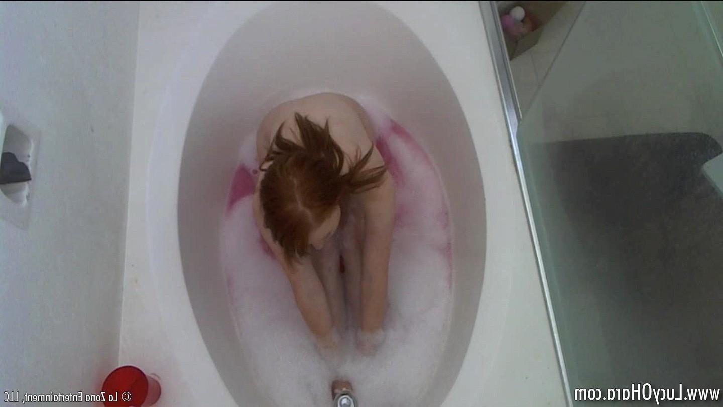 15P Busty redhead Lucy bathing
