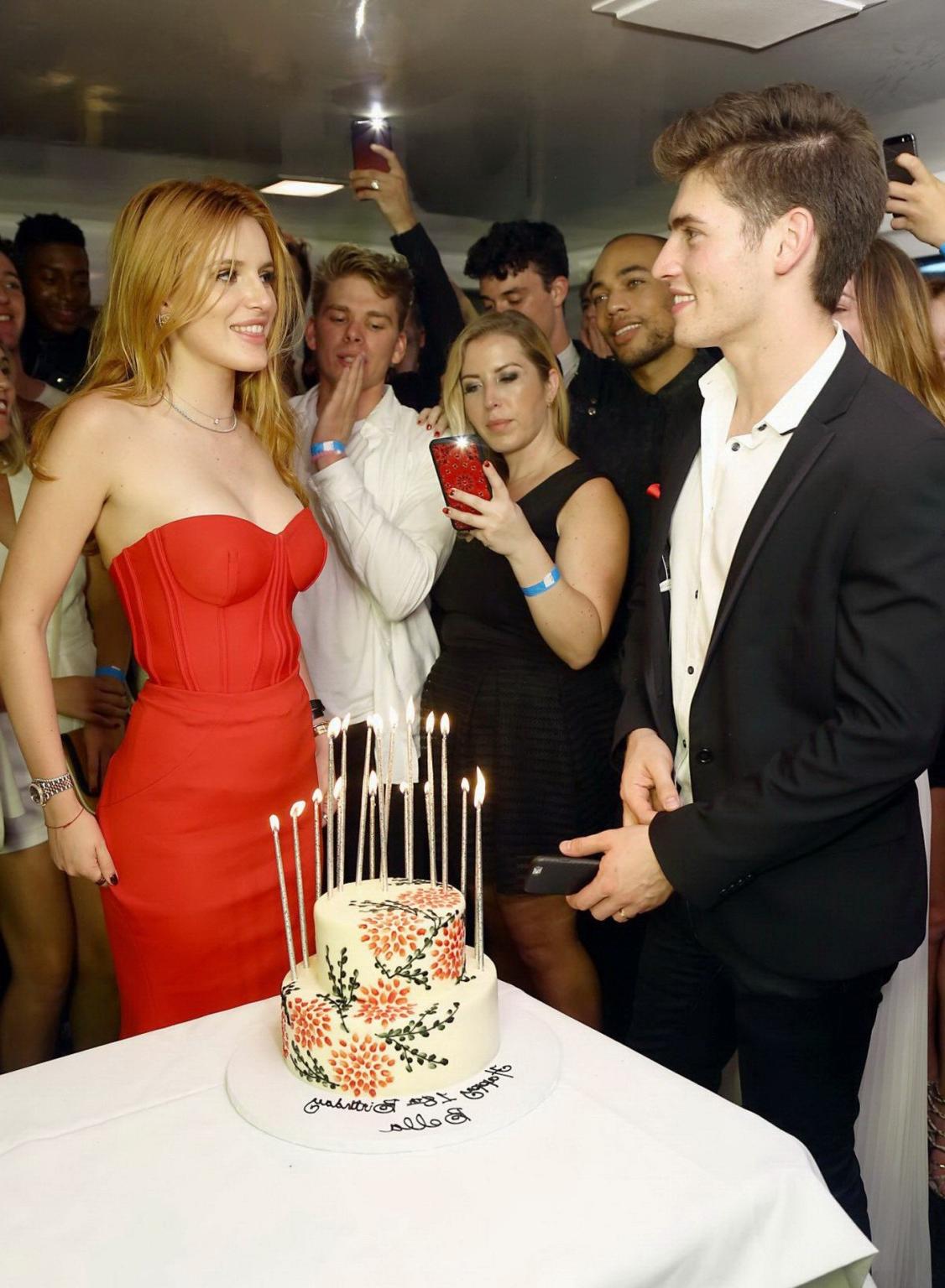 16P Bella Thorne busty in tight red tube dress for her birthday