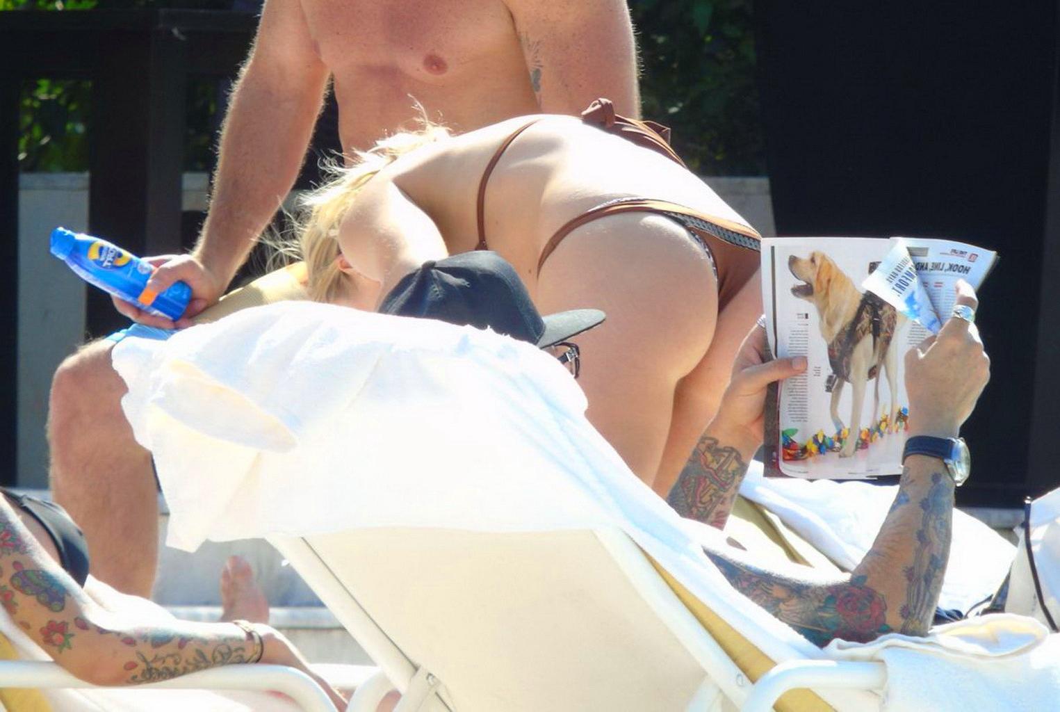 16P LeAnn Rimes showing ass in a brown thong bikini at the pool in Mexico