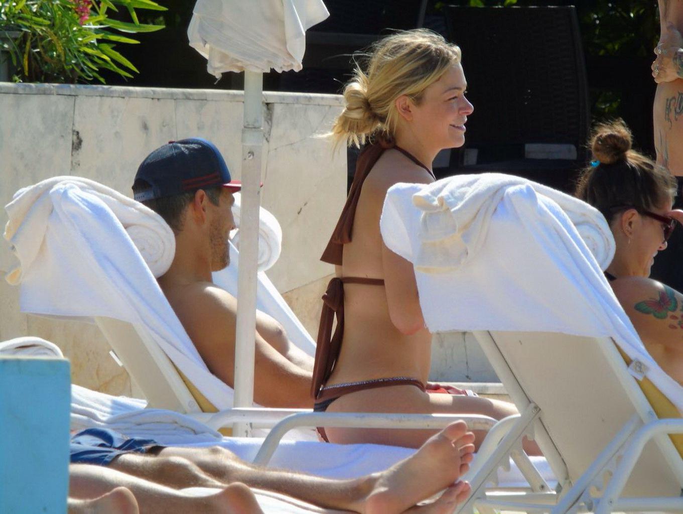 16P LeAnn Rimes showing ass in a brown thong bikini at the pool in Mexico