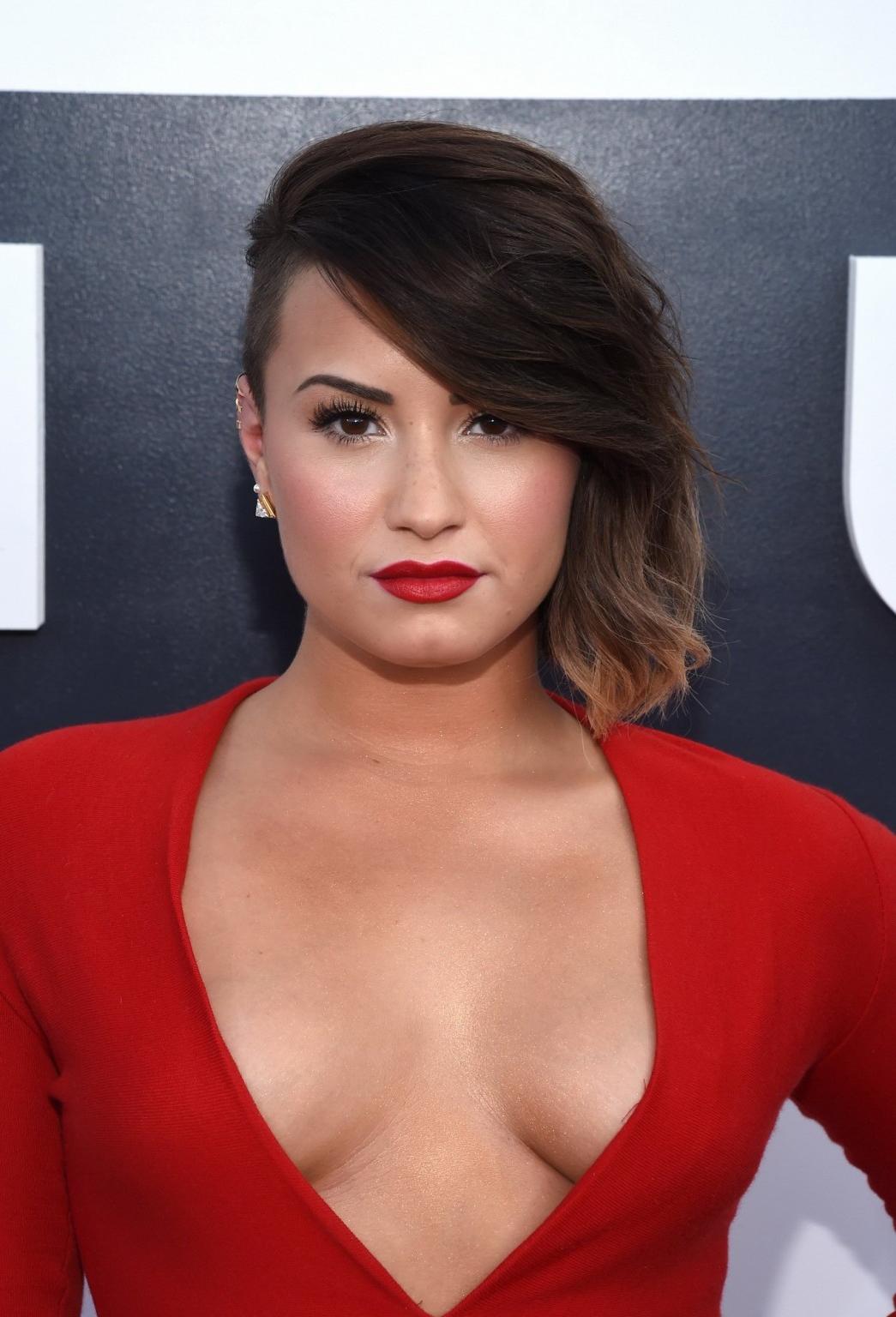16P Demi Lovato braless in a low cut  high slit red dress at 2014 MTV Video Music Aw