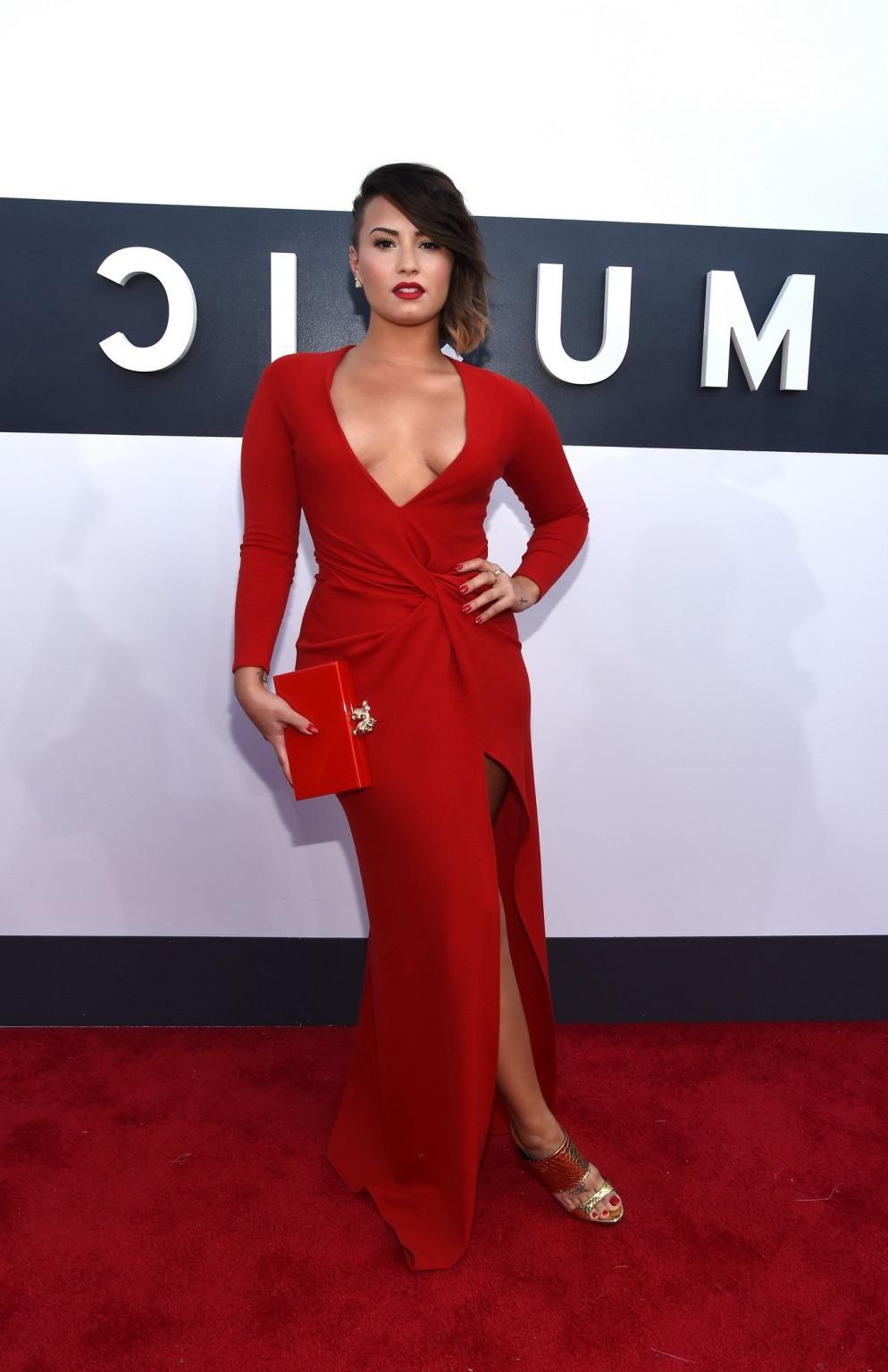 16P Demi Lovato braless in a low cut  high slit red dress at 2014 MTV Video Music Aw