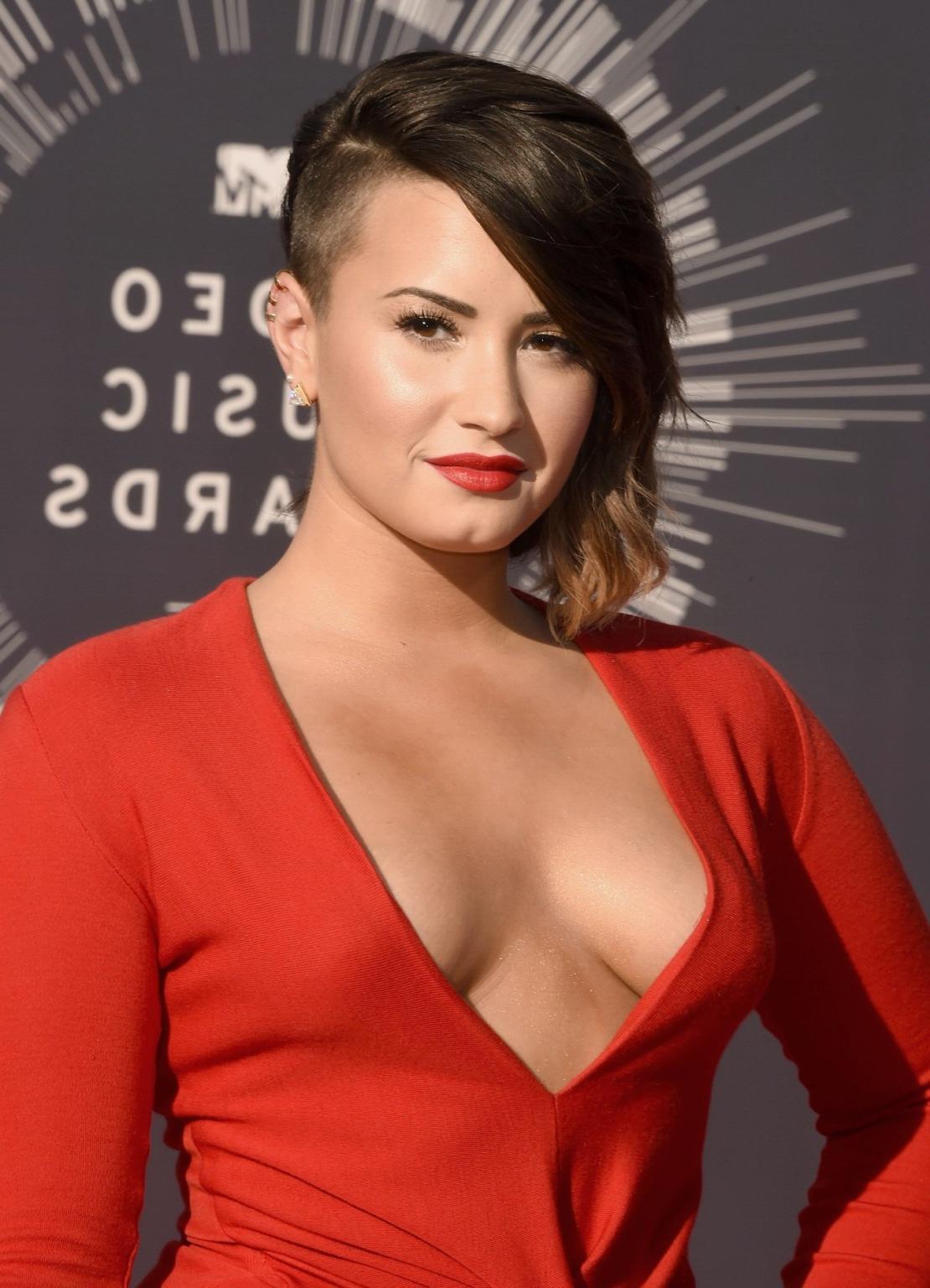 16P Demi Lovato braless in a low cut  high slit red dress at 2014 MTV Video Music Aw