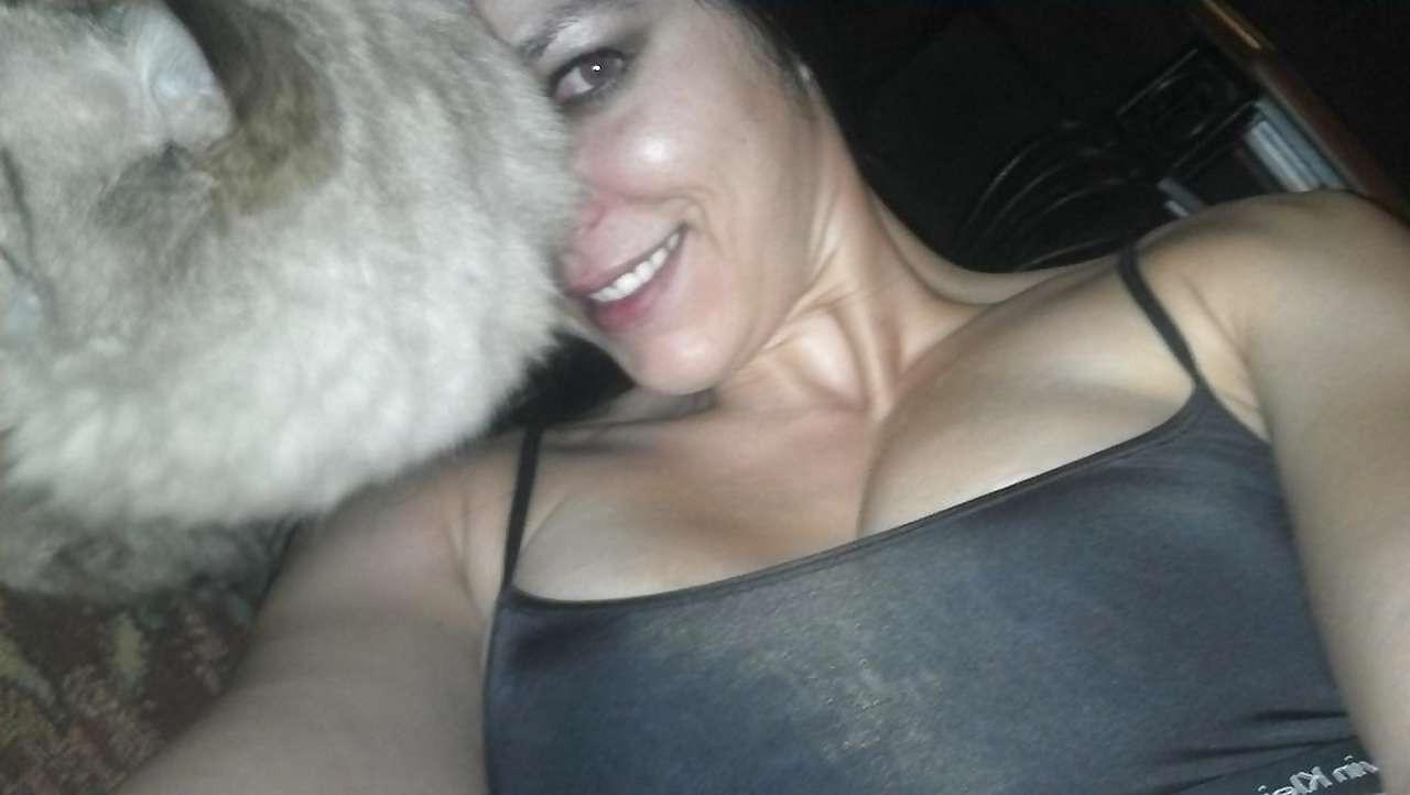 10P Adrianne Curry showing her great ass in thong and posing topless