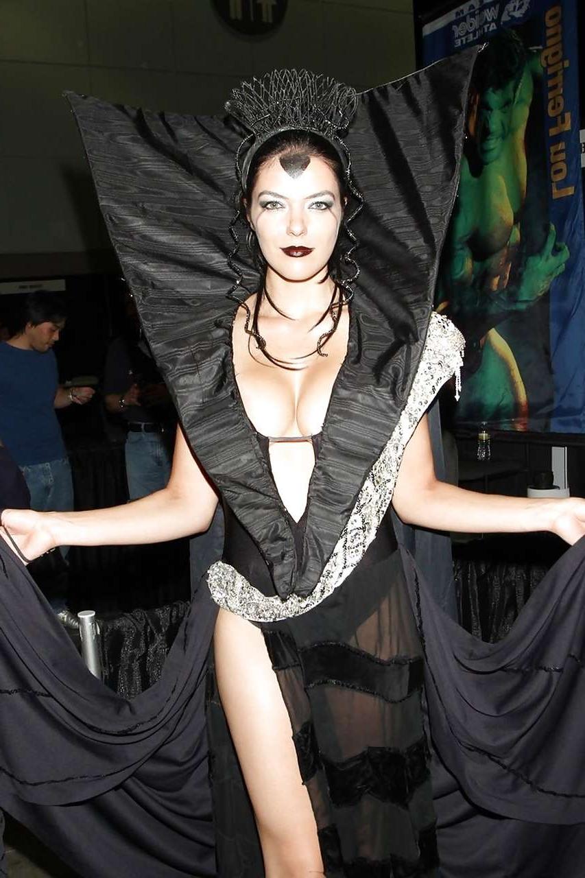 10P Adrianne Curry showing her great ass in thong and posing topless