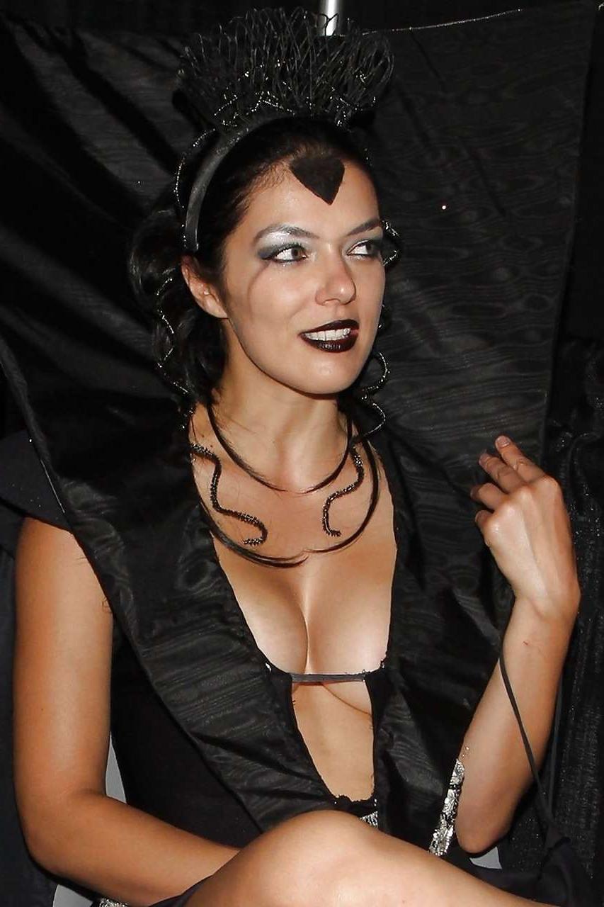 10P Adrianne Curry showing her great ass in thong and posing topless