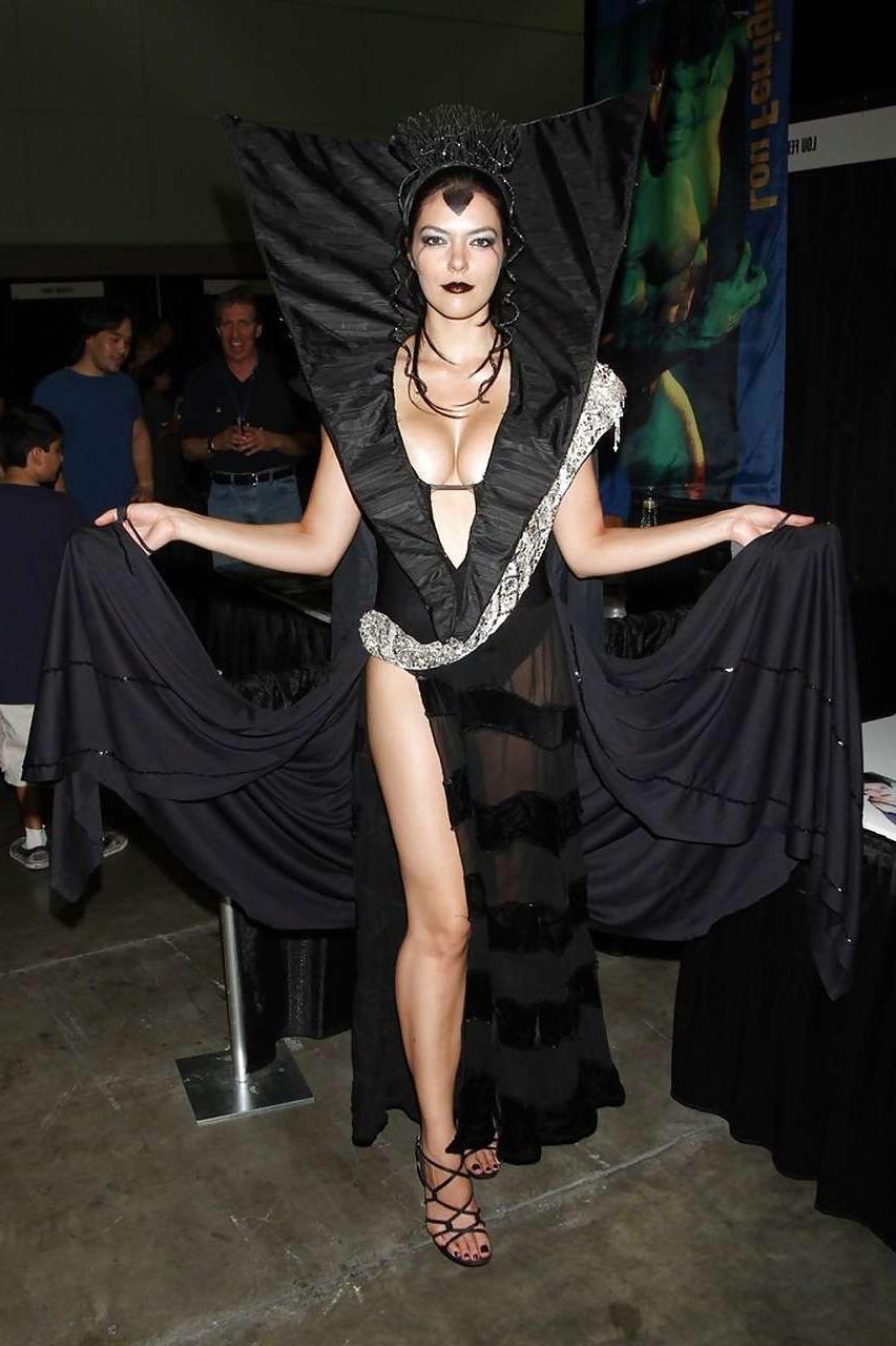 10P Adrianne Curry showing her great ass in thong and posing topless