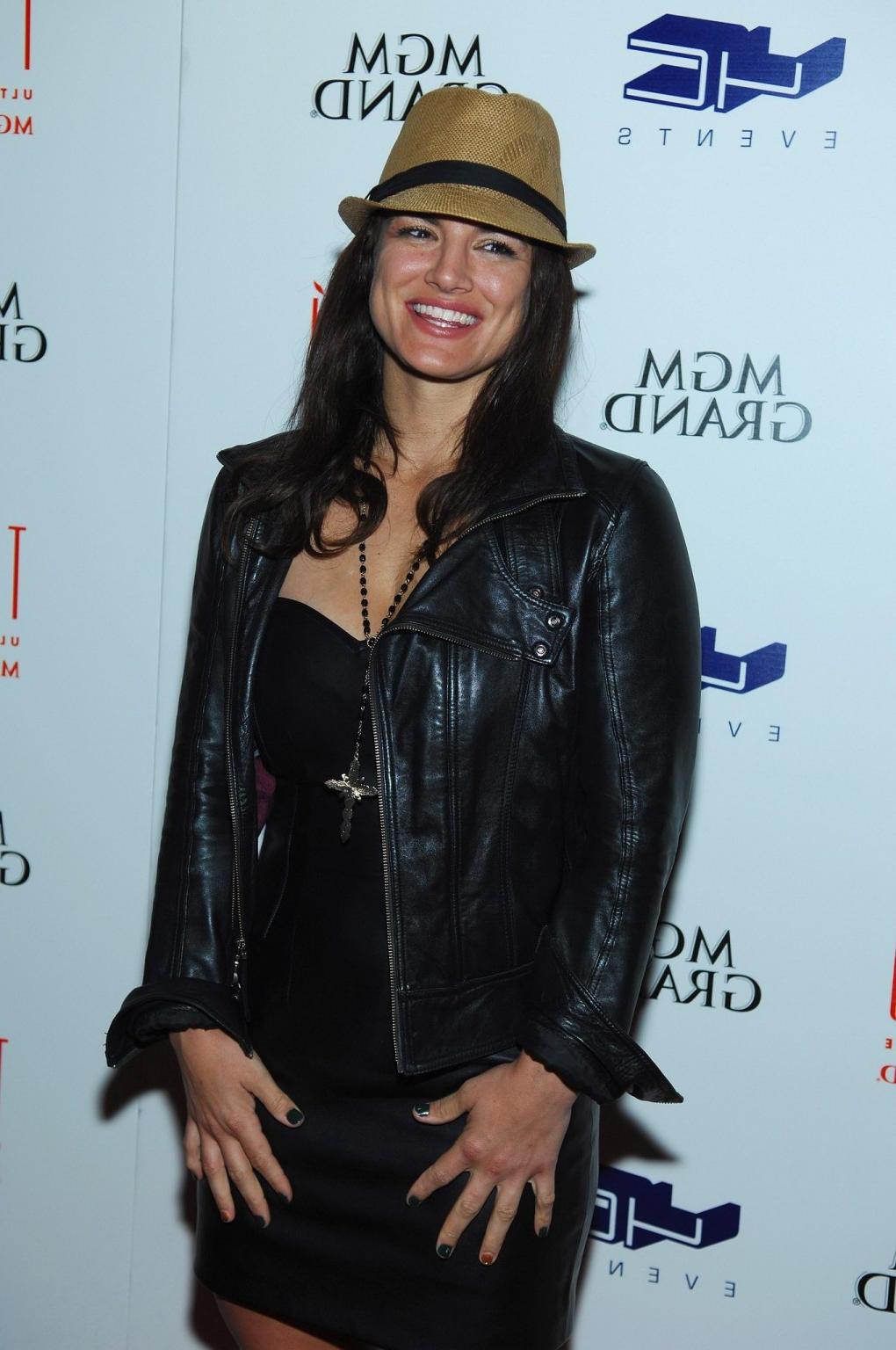 10P Gina Carano leggy wearing a leather mini dress at the birthday party in Las Vega