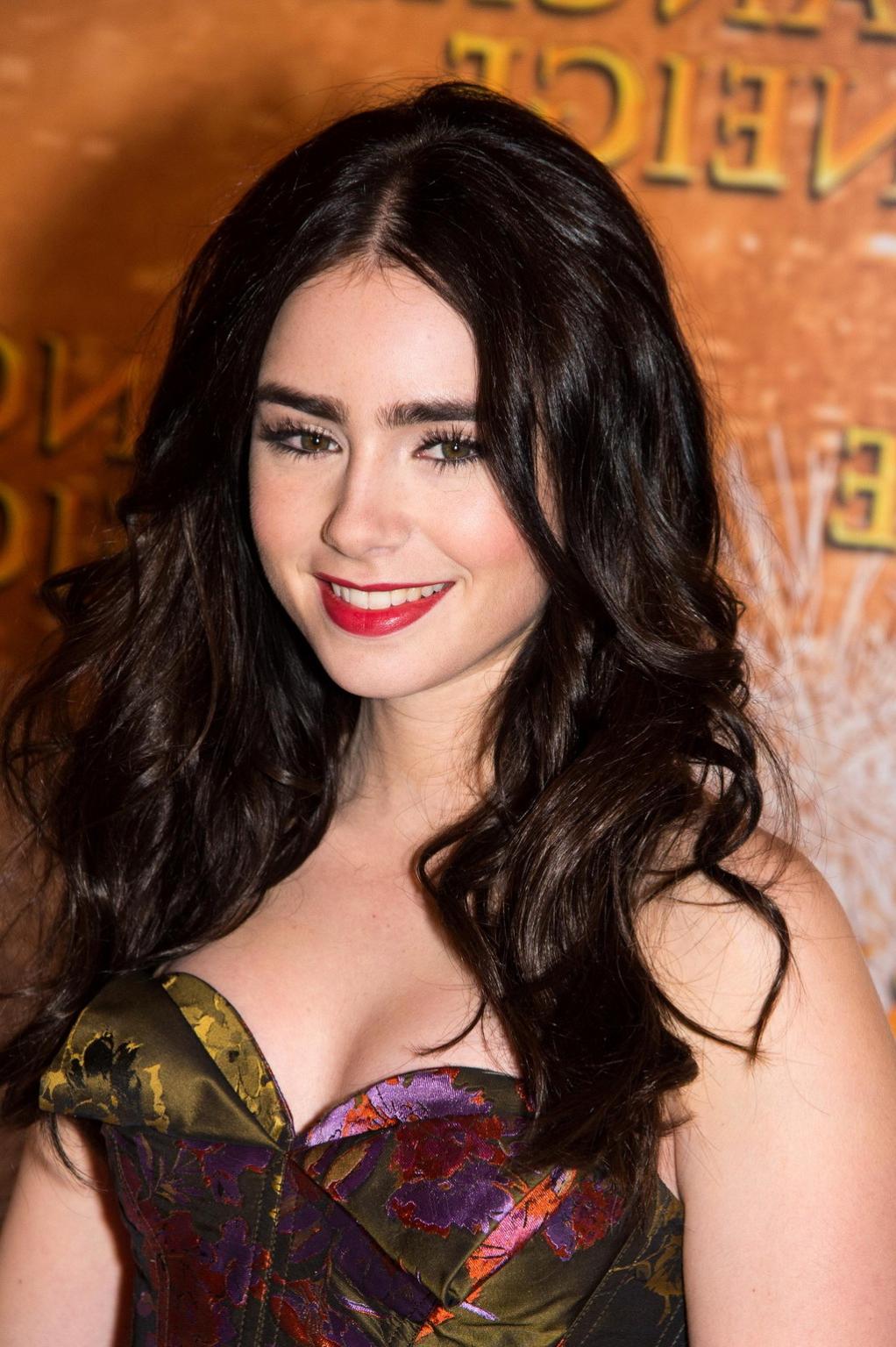 16P Lily Collins braless in the strapless dres at Mirror Mirror premiere in Paris
