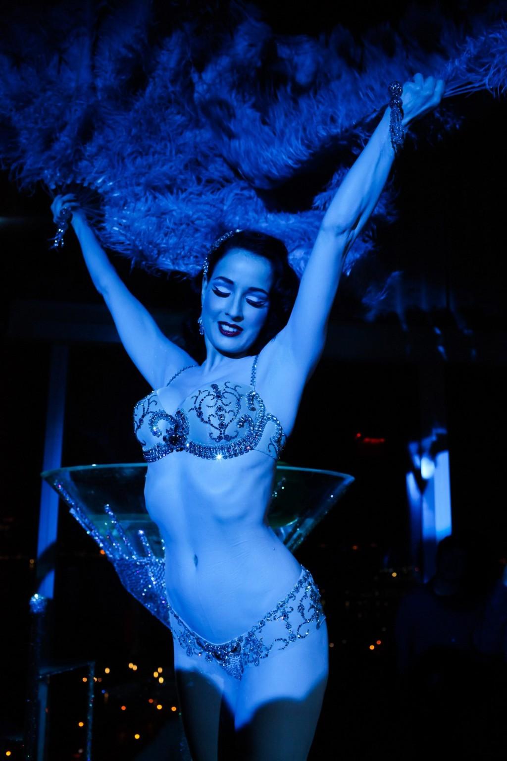 16P Dita Von Teese wearing nip stickers  thong while bathing in a giant martini glas