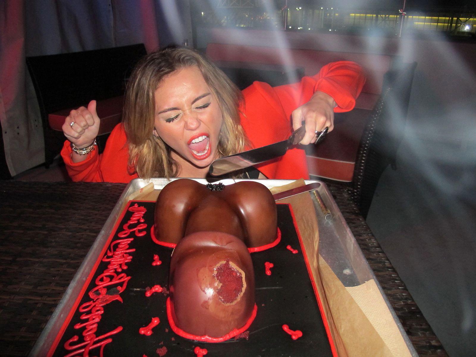 16P Miley Cyrus licking a huge cock-shaped cake at her birthday party in LA