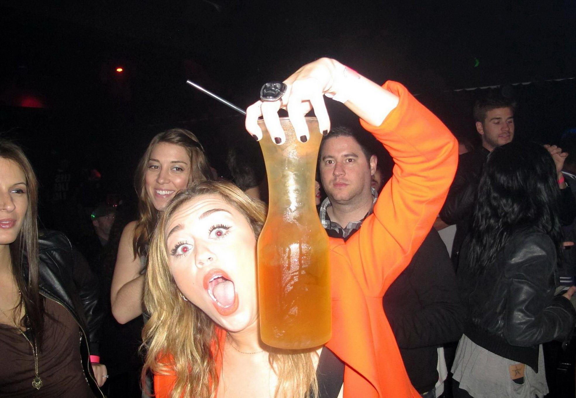 16P Miley Cyrus licking a huge cock-shaped cake at her birthday party in LA