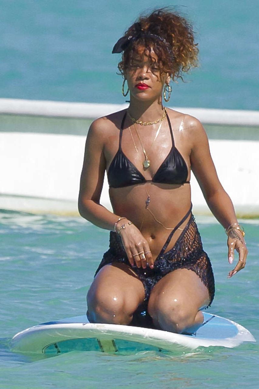 16P Rihanna showing her great ass in black thong on beach paparazzi photos
