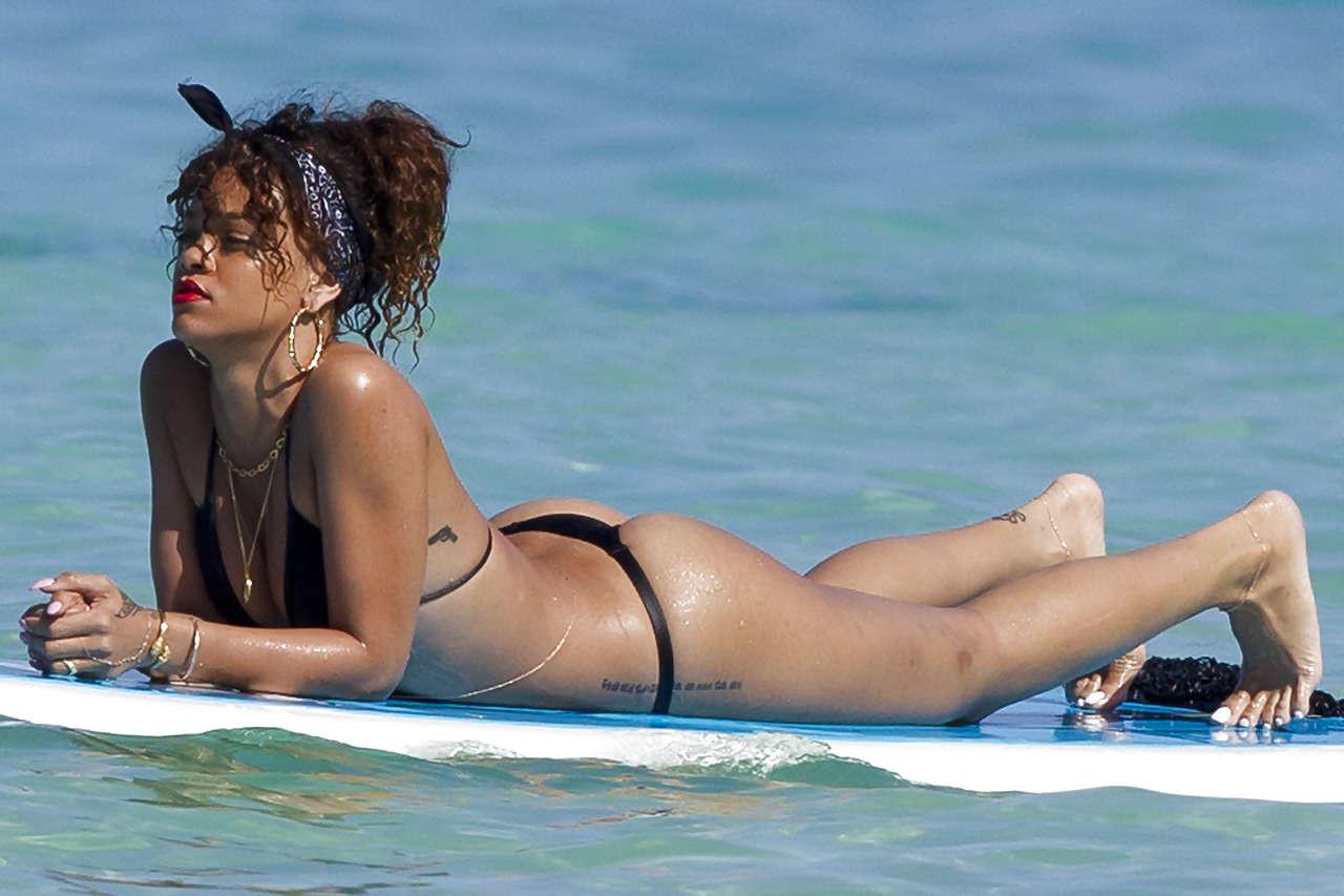 16P Rihanna showing her great ass in black thong on beach paparazzi photos