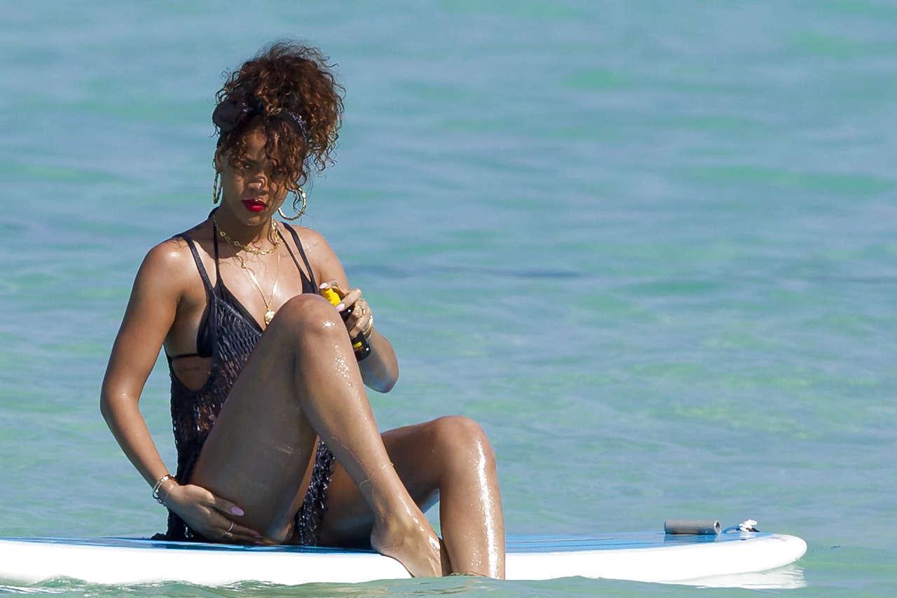 16P Rihanna showing her great ass in black thong on beach paparazzi photos