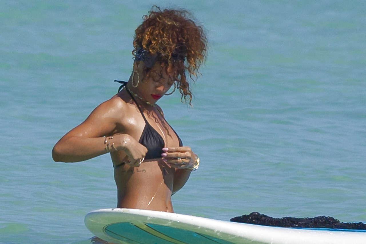 16P Rihanna showing her great ass in black thong on beach paparazzi photos