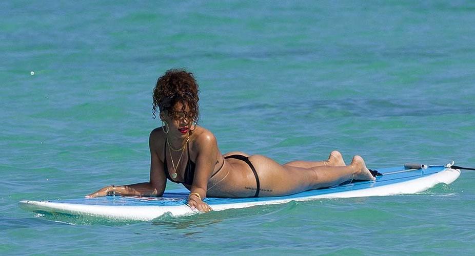 16P Rihanna exposing sexy body and hot ass in thong while surfing