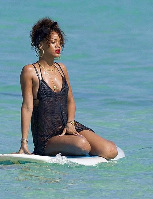16P Rihanna exposing sexy body and hot ass in thong while surfing