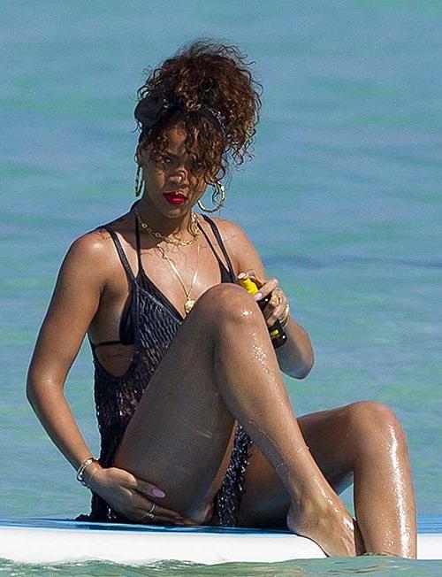 16P Rihanna exposing sexy body and hot ass in thong while surfing
