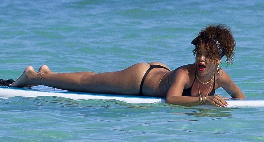 16P Rihanna exposing sexy body and hot ass in thong while surfing