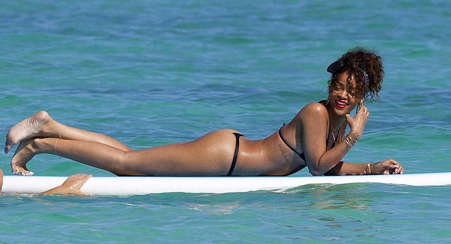 16P Rihanna exposing sexy body and hot ass in thong while surfing