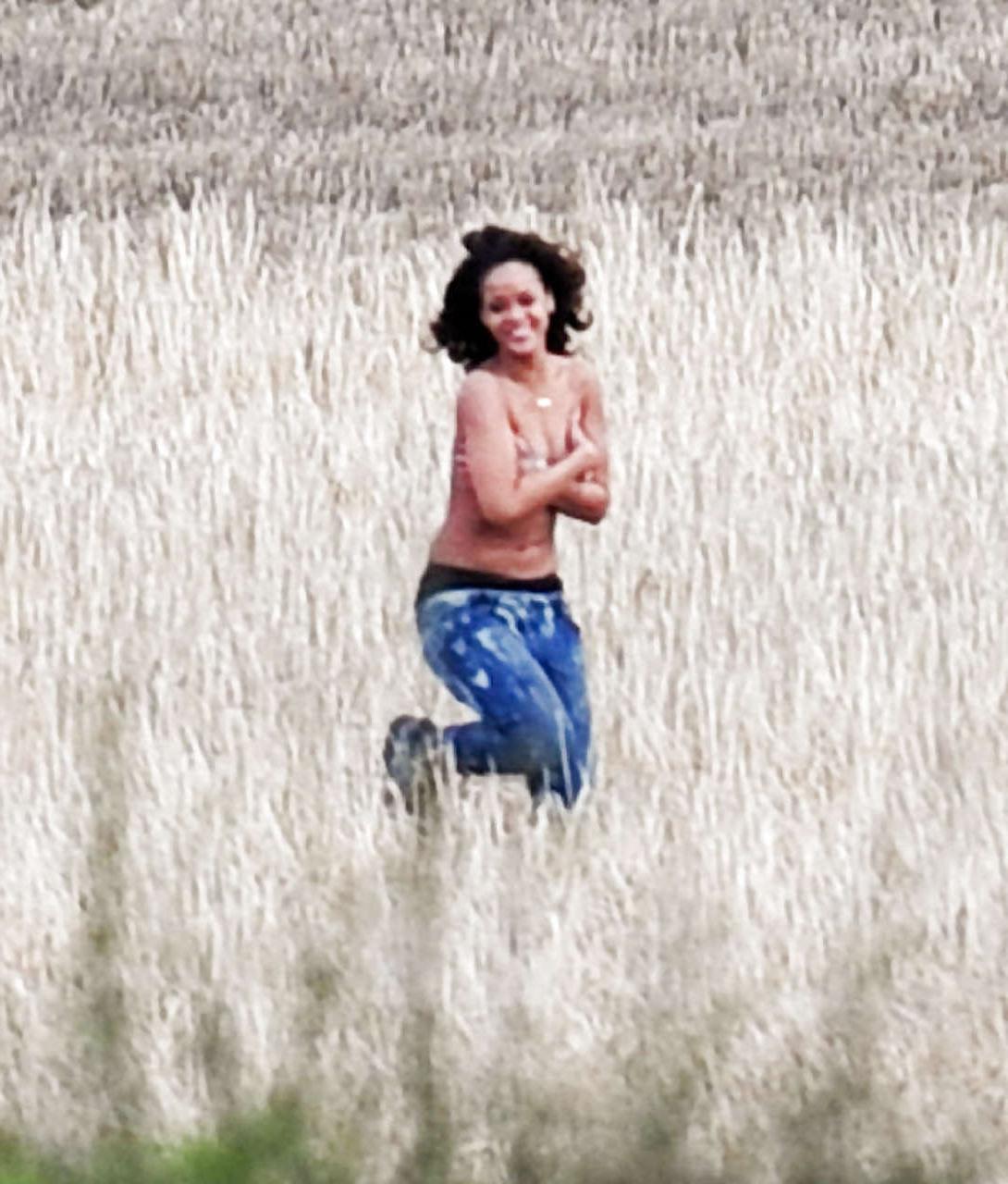 16P Rihanna topless paparazzi pictures while making video and on stage in fishnets